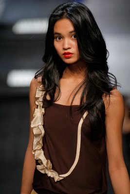 Model wearing brown Abigail McCannon design