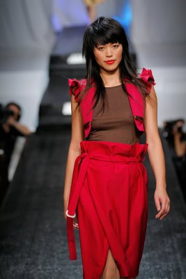 Model wearing red Abigail McCannon design