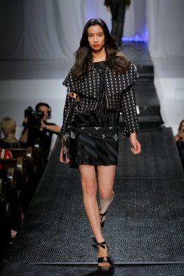 Model in black mini skirt by Alix Hadley