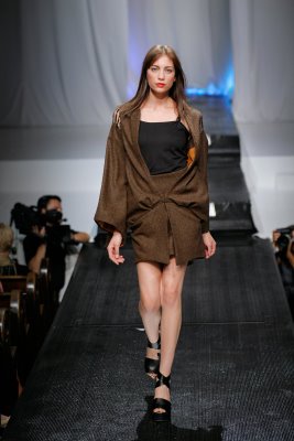 Model in brown mini skirt by Alix Hadley
