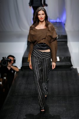 Model in polka dot pants and brown top by Alix Hadley