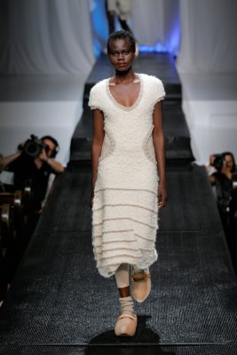 Model wearing white dress by Elieza S. Perez