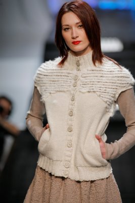Model wearing white knit top by Elieza S. Perez