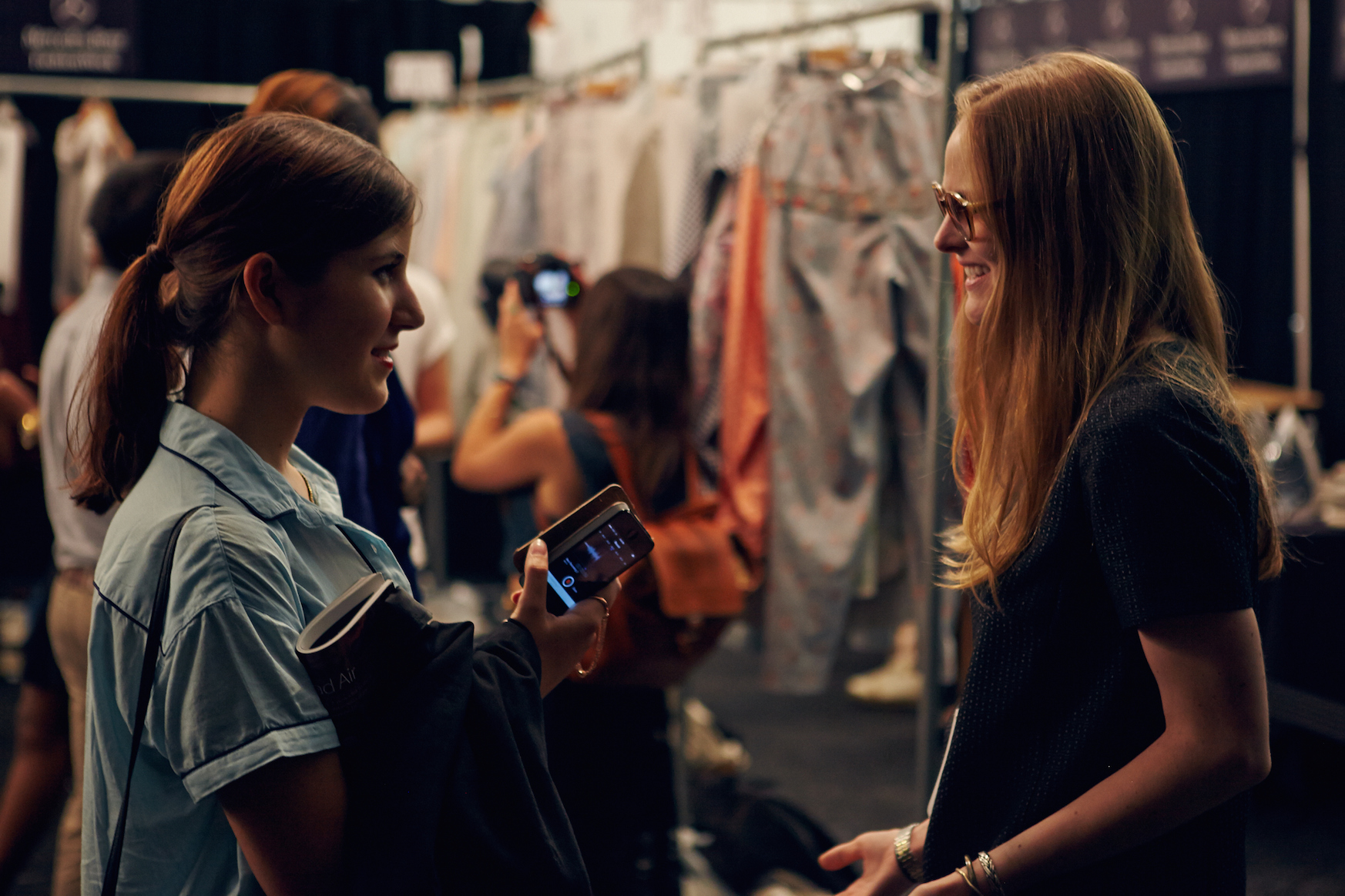 Alex Suarez backstage at the Academy of Art University New York Fashion Week Spring 2015 show, interviewing designer Madison Detro