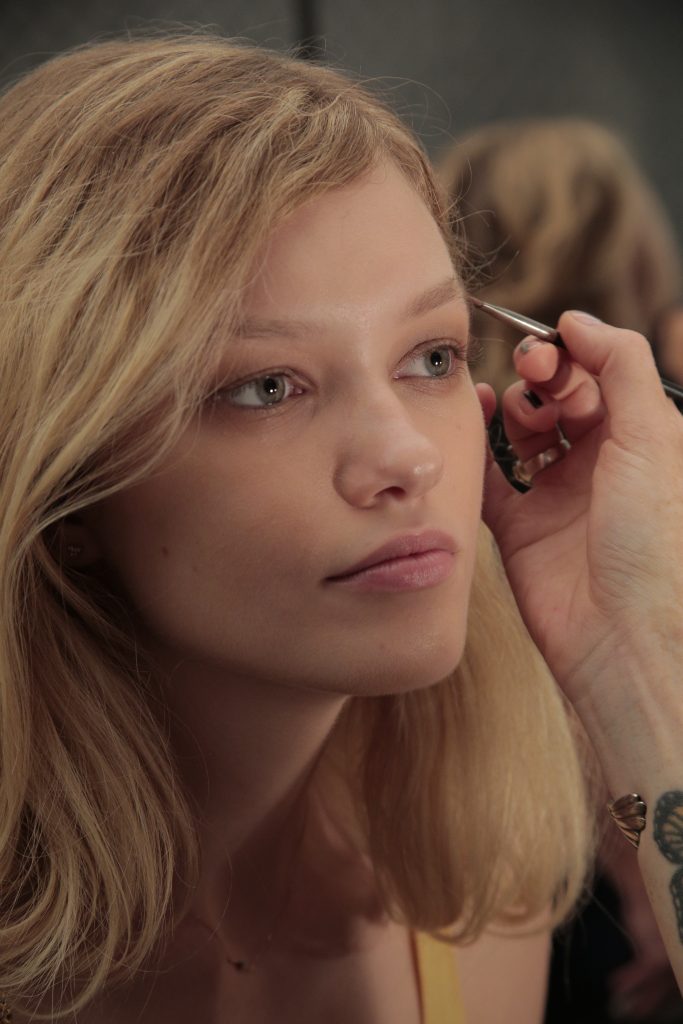 A model prepares at the Academy of Art University Spring 2017 Collections during New York Fashion Week at The Arc, Skylight at Moynihan Station on September 10, 2016 in New York City.