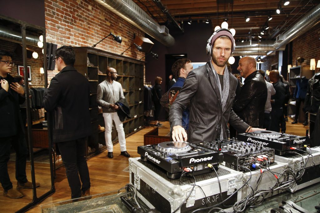 Guests shop to the musical stylings of DJ Andrés Sette Arruza. (Photo by Kimberly White/Getty Images for John Varvatos)
