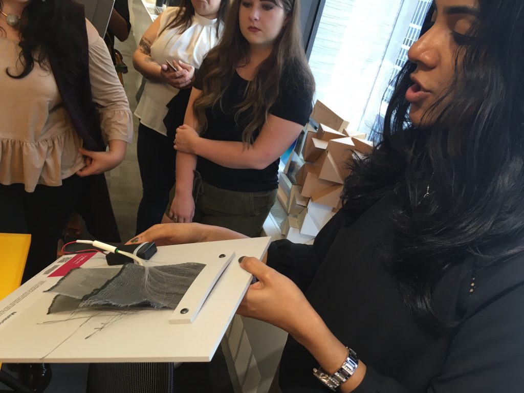 Gayatri Keskar, Material Scientist at Material ConneXion- Showing the students a Flexible, lightweight, translucent Fiber Optic Fabric from LumiGram SARL . Image Source: Iliana Ricketts