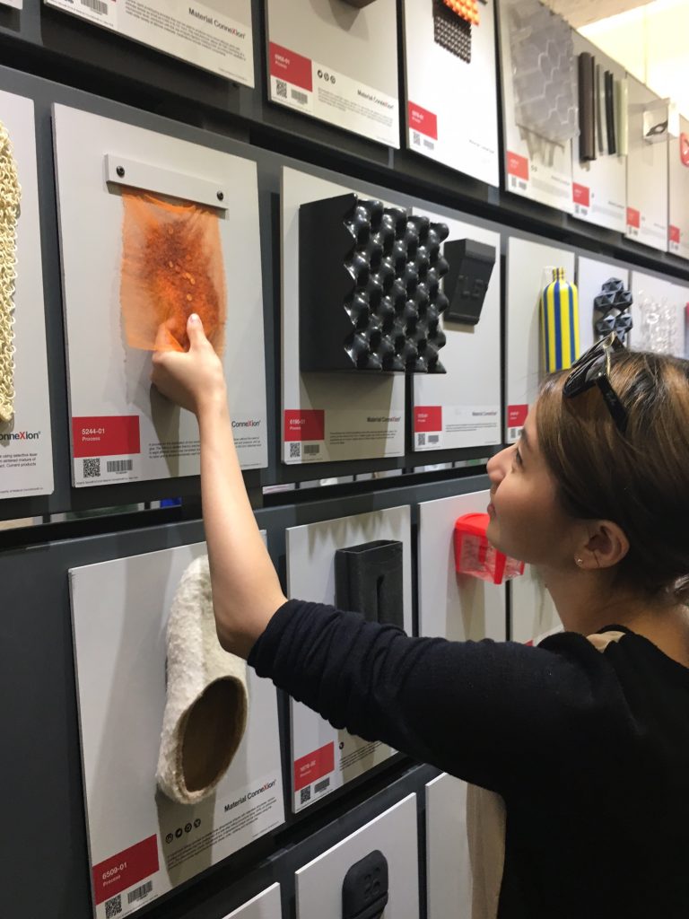 Avie Liu, MFA Fashion Merchandising; Looking at a felted material created by a thermo-mechanical process from Gottstein GmbH & Co. KG. Image Source: Iliana Ricketts 