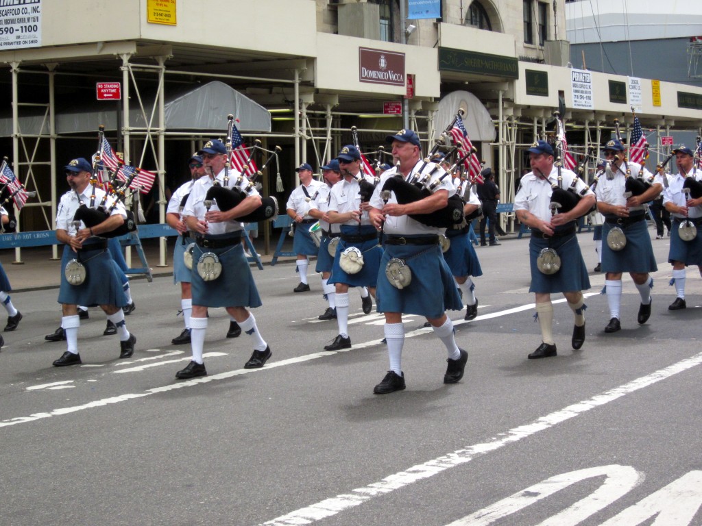 img_1541 Sword and Light Pipe Band in kilts with flags