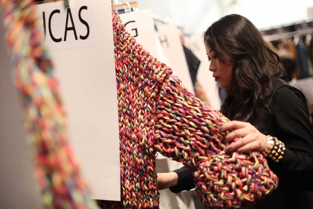 Stella Xingyu Hu, M.F.A. Fashion Design, checking out her collection. Image: David Dooley