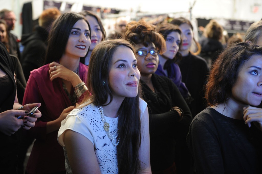 Designers watching and waiting backstage as their collections come down the runway. Image: David Dooley
